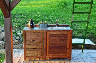 a sink and a ladder on a wooden deck at Johanca in Obrov