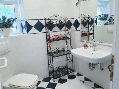 a white bathroom with a sink and a toilet at Heaven Can Wait Country Retreat in Poljane nad Škofjo Loko