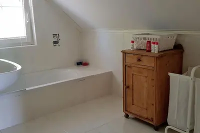 a white bathroom with a tub and a sink at Heaven Can Wait Country Retreat in Poljane nad Škofjo Loko