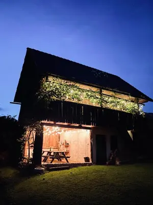 a building with a picnic table on the side of it at House 44 in Bled