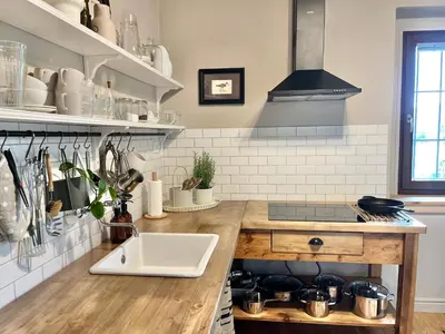 a kitchen with a sink and a counter at House 44 in Bled