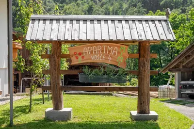 a wooden gazebo with a sign that readsarma voice at Apartma Mimi in Radovljica