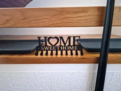 a sign that says home sweet home on a shelf at Zoya Bled Apartments in Bled