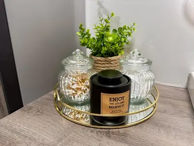 a tray with two glass jars on a table at Superior Holiday Home Fortuna in Čatež ob Savi