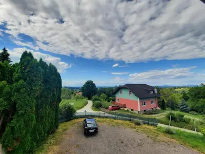 a car parked in front of a house at Apartma Grlica in Selnica ob Muri