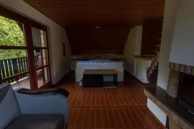 a living room with a couch and a table at Domačija Marinč in Kostel