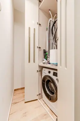 a laundry room with a washer and dryer at Apartment Hajdi with Sauna & Garage in Bovec