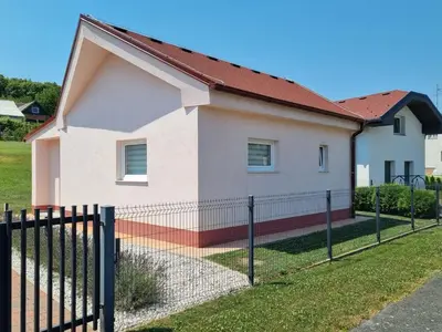a house with a fence in front of it at Apartma Anci in Prosenjakovci