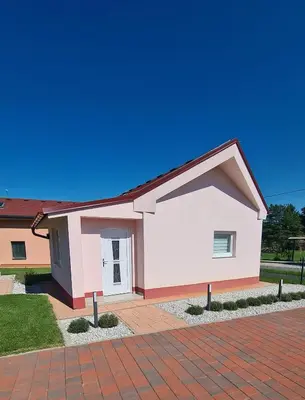a house with a red brick driveway at Apartma Anci in Prosenjakovci