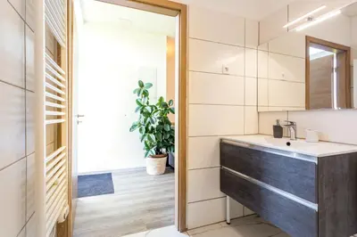 a bathroom with a sink and a mirror at Apartma Majdas in Loka pri Mengšu