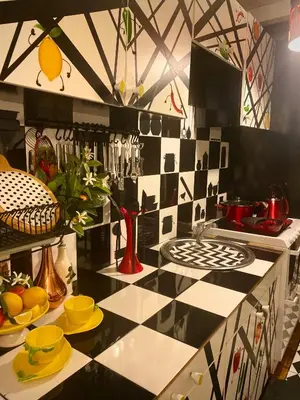 a kitchen with a black and white tiled counter at Centralish Dragon Heart Ljubljana in Ljubljana