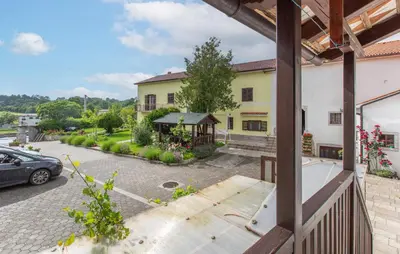 a view from the balcony of a house with a car at 1 Bedroom Beautiful Apartment In Divaca in Divača