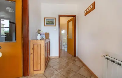 a hallway with a hallway leading to a bathroom at 1 Bedroom Beautiful Apartment In Divaca in Divača
