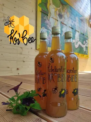 three bottles of honey sitting on top of a table at Apartments Kr'Bee in Mala Nedelja