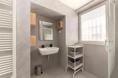 a bathroom with a sink and a mirror at Aroma apartments in Ljubljana