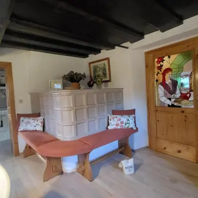 a bench in the corner of a room at House 29 in Begunje na Gorenjskem
