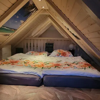 a bed in the attic of a room at House 29 in Begunje na Gorenjskem