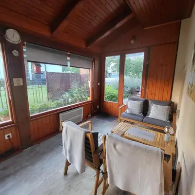 a living room with a couch and a table at House 29 in Begunje na Gorenjskem