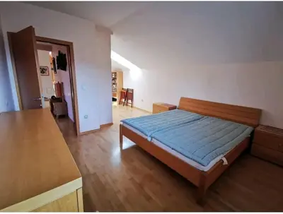 a bedroom with a bed with a blue mattress at Morning sunshine in Bled