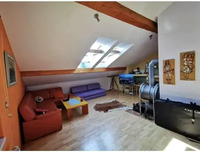 a living room with a couch and a table at Morning sunshine in Bled