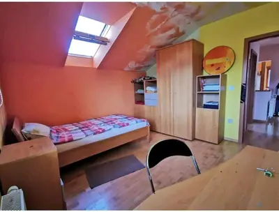 a bedroom with a bed in a room at Morning sunshine in Bled