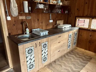 a kitchen with a sink and a counter top at Somova gora chalet in the woods in Kočevje