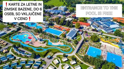 an aerial view of a resort with a pool at Hiška 111 s kopalnimi kartami in Brežice