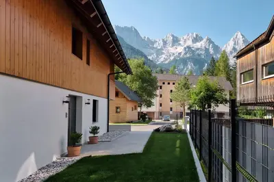 a courtyard with a view of a mountain at Hiša Oblak in Gozd Martuljek