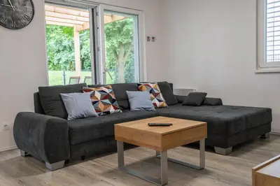 a living room with a couch and a coffee table at Apartment Swim and Relax in Moravske Toplice