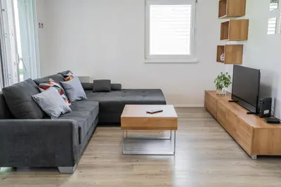 a living room with a couch and a coffee table at Apartment Swim and Relax in Moravske Toplice