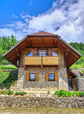 a log home with a balcony on top of it at Holiday home in Dolenjske Toplice - Kranjska (Krain) 51092 in Dolenjske Toplice