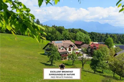 a house on a hill with a sign in front of it at Turistična kmetija Pri Marku in Žabnica