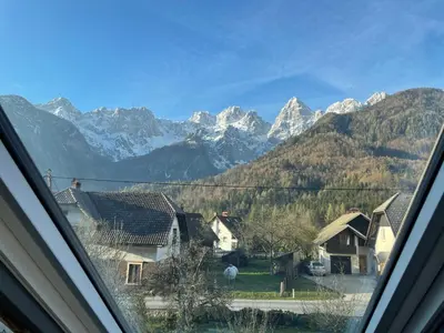 a view from a window of a village with mountains at Walter Apartments in Gozd Martuljek