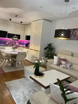 a living room with a couch and a table at Apartment Anaa in Radovljica