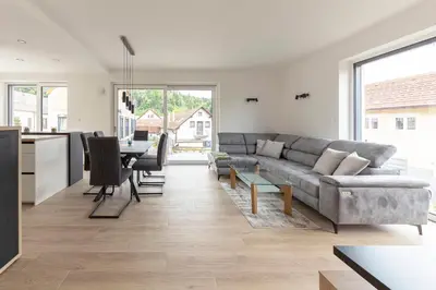 a living room with a couch and a table at Apartment Božica in Ljubljana