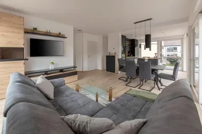 a living room with a couch and a dining room at Apartment Božica in Ljubljana