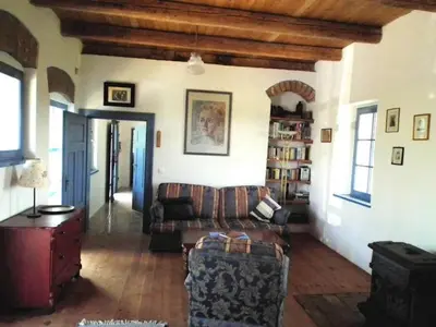 a living room with a couch and a table at Paulusberg Comfortable holiday residence in Ivanjkovci