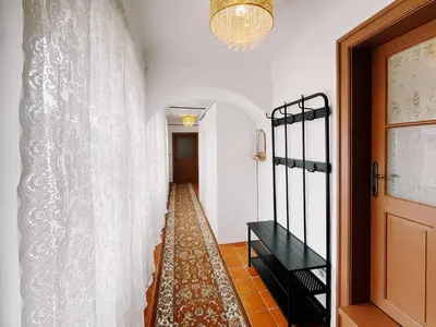 a hallway with a white curtain and a door at Cozy flat in Center in Maribor