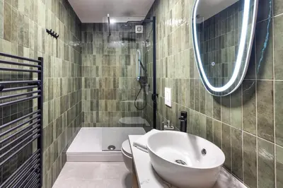 a bathroom with a sink and a toilet and a tub at Apartment MYSA, Nordic House, Kranjska Gora - Center in Kranjska Gora