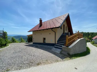 a small white house with a red roof at Vineyard Cottage Joanna in Mirna Peč