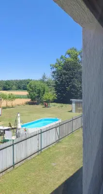 a swimming pool in a yard with a fence at WoW sleeping in Miklavž na Dravskem Polju