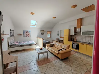 a living room with a couch and a table at WoW sleeping in Miklavž na Dravskem Polju