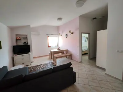 a living room with a couch and a table at WoW sleeping in Miklavž na Dravskem Polju