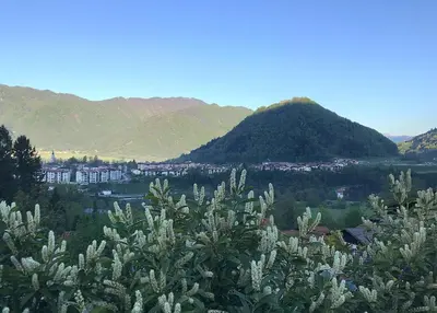 a view of a city with mountains in the background at Apartma Savan in Tolmin