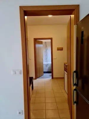 a hallway with a door leading to a room at Woodstone 6 in Pekre
