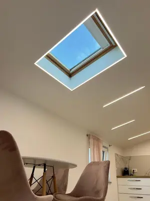 a skylight in a room with a table and chairs at APP Krofek in Zgornje Škofije