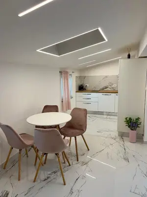 a dining room with a table and chairs at APP Krofek in Zgornje Škofije