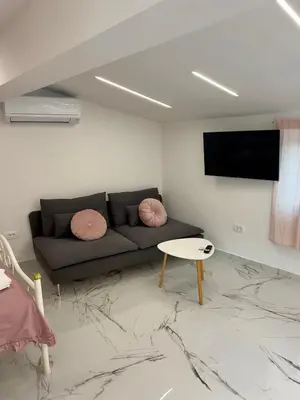 a living room with a couch and a table at APP Krofek in Zgornje Škofije