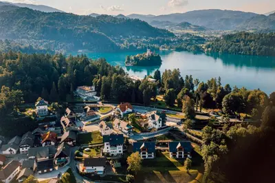 an aerial view of a village on a lake at Mlino Alpino in Bled