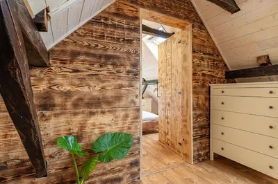 a room with a wall of wood at Kolpa Holidays in Gradac